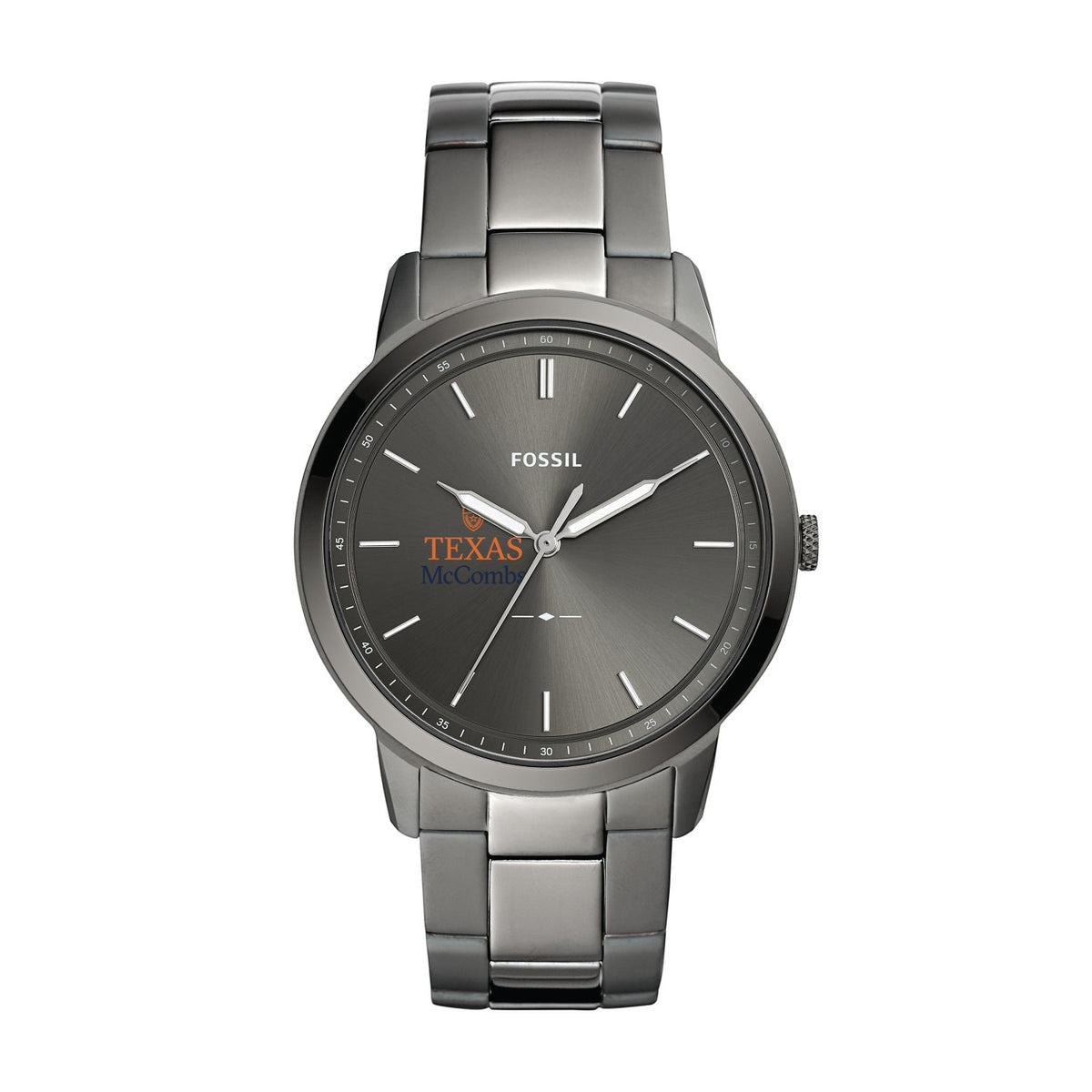 Fossil wristwatch with a round stainless steel case and matching metal link bracelet, featuring a dark gray dial with silver hour markers and hands. The dial includes the Fossil brand name and a Texas McCormick logo.
