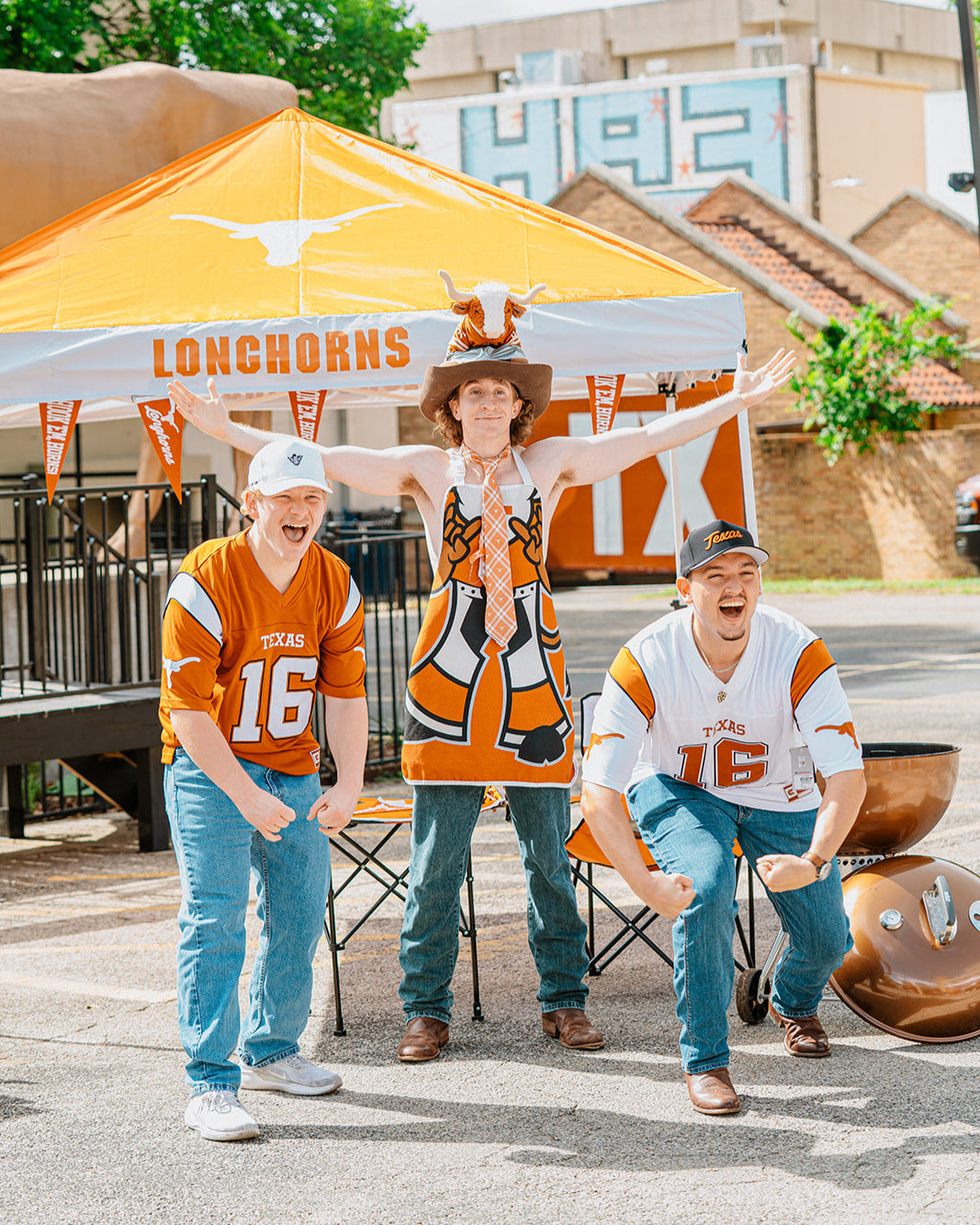Texas Longhorns tailgating with manning shirts. 