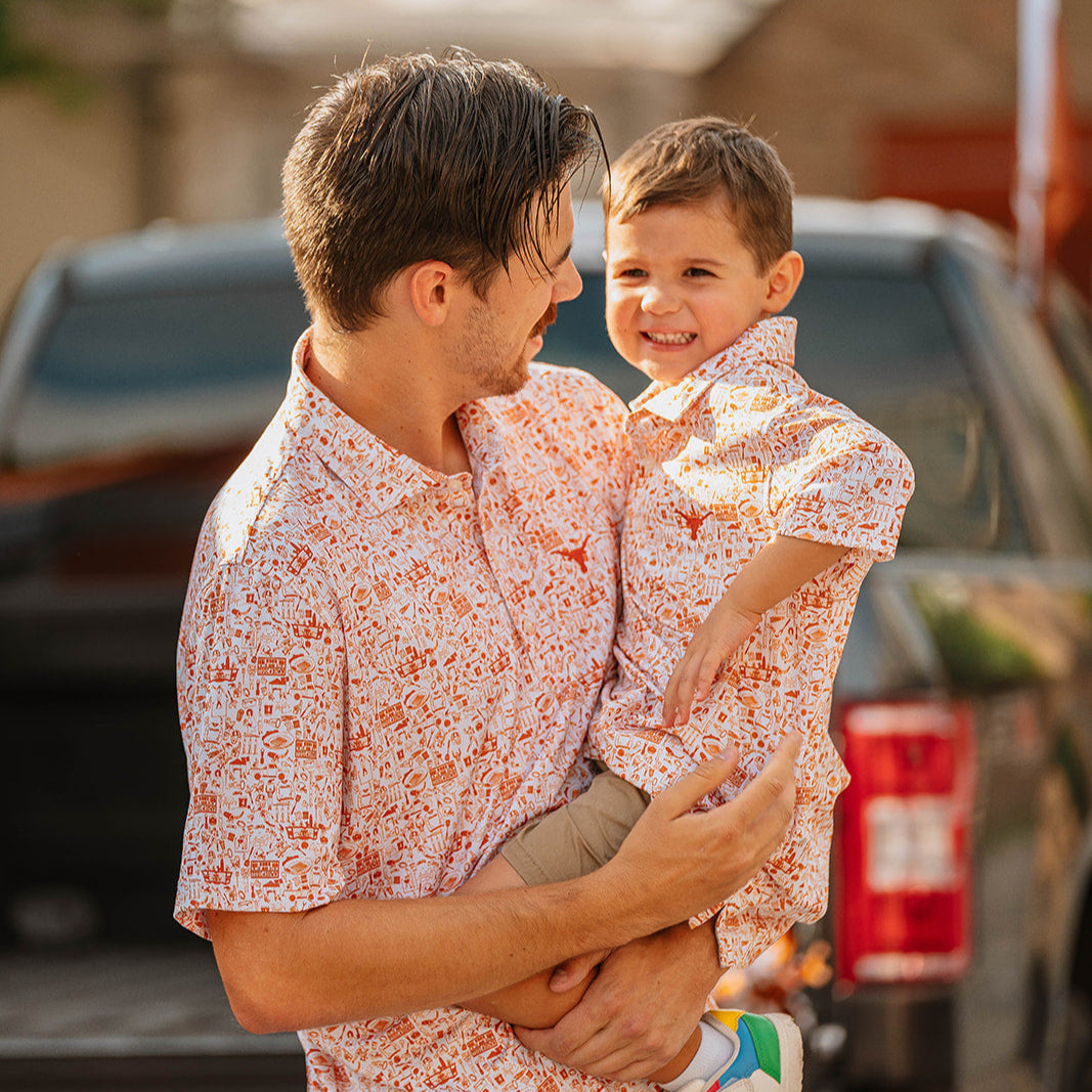 Dad and son wearing matching Burnt Orange Longhorn Polos