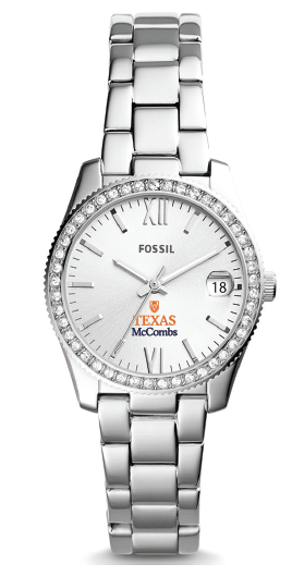 Fossil women's watch with a silver stainless steel link bracelet, a crystal-studded bezel, and a white dial with Roman numerals, a date window, and Fossil Texas McCombs branding.