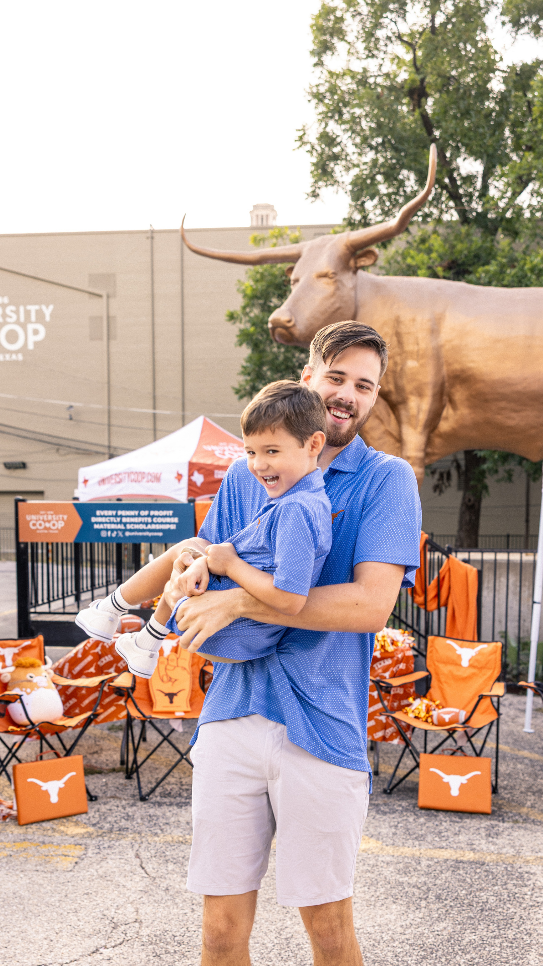 Dad and kid both wearing Longhorn polos! Celebrating at a tailgate 