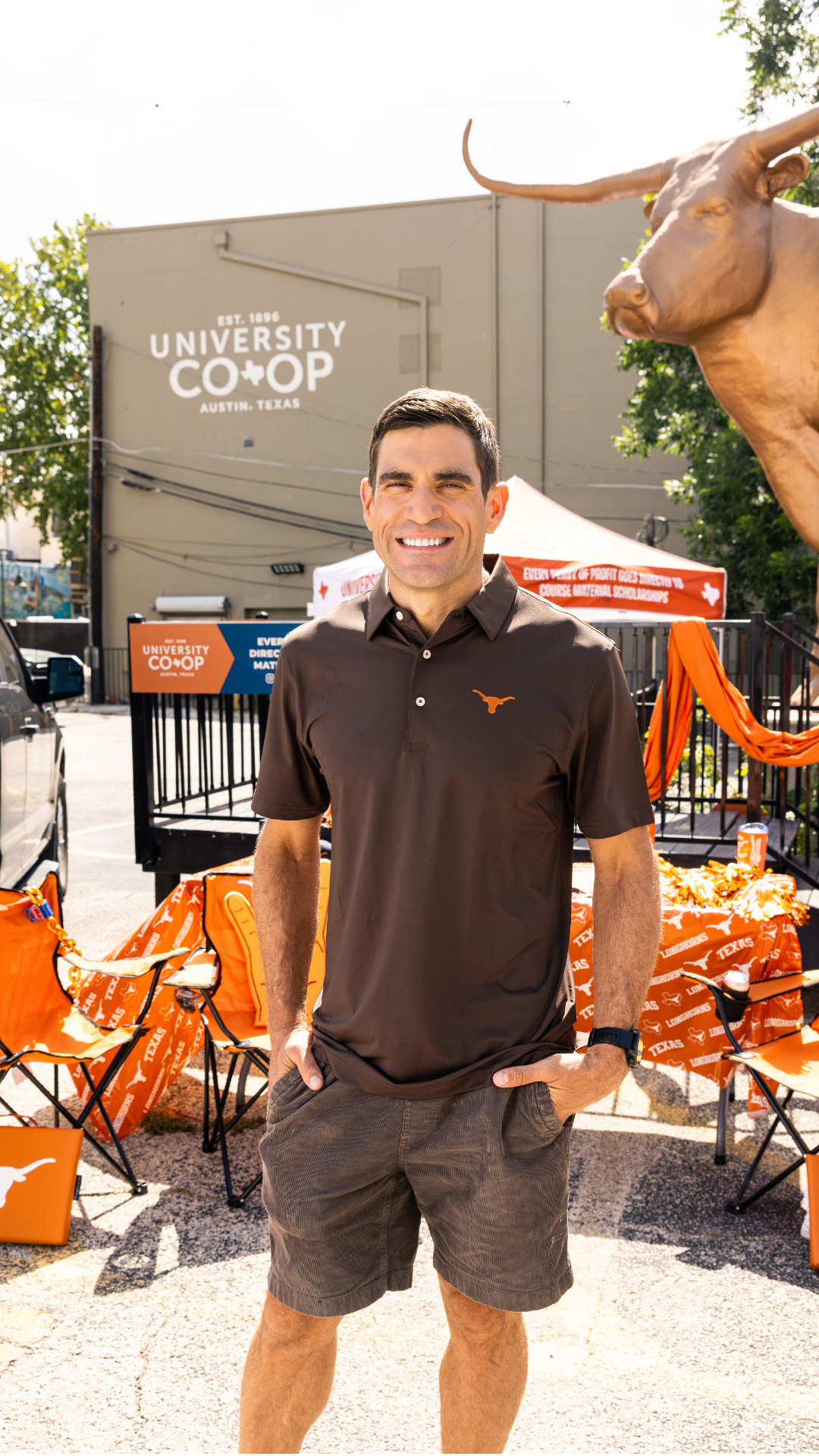 Longhorn fan wearing a longhorn polo at a tailgate event for the football 