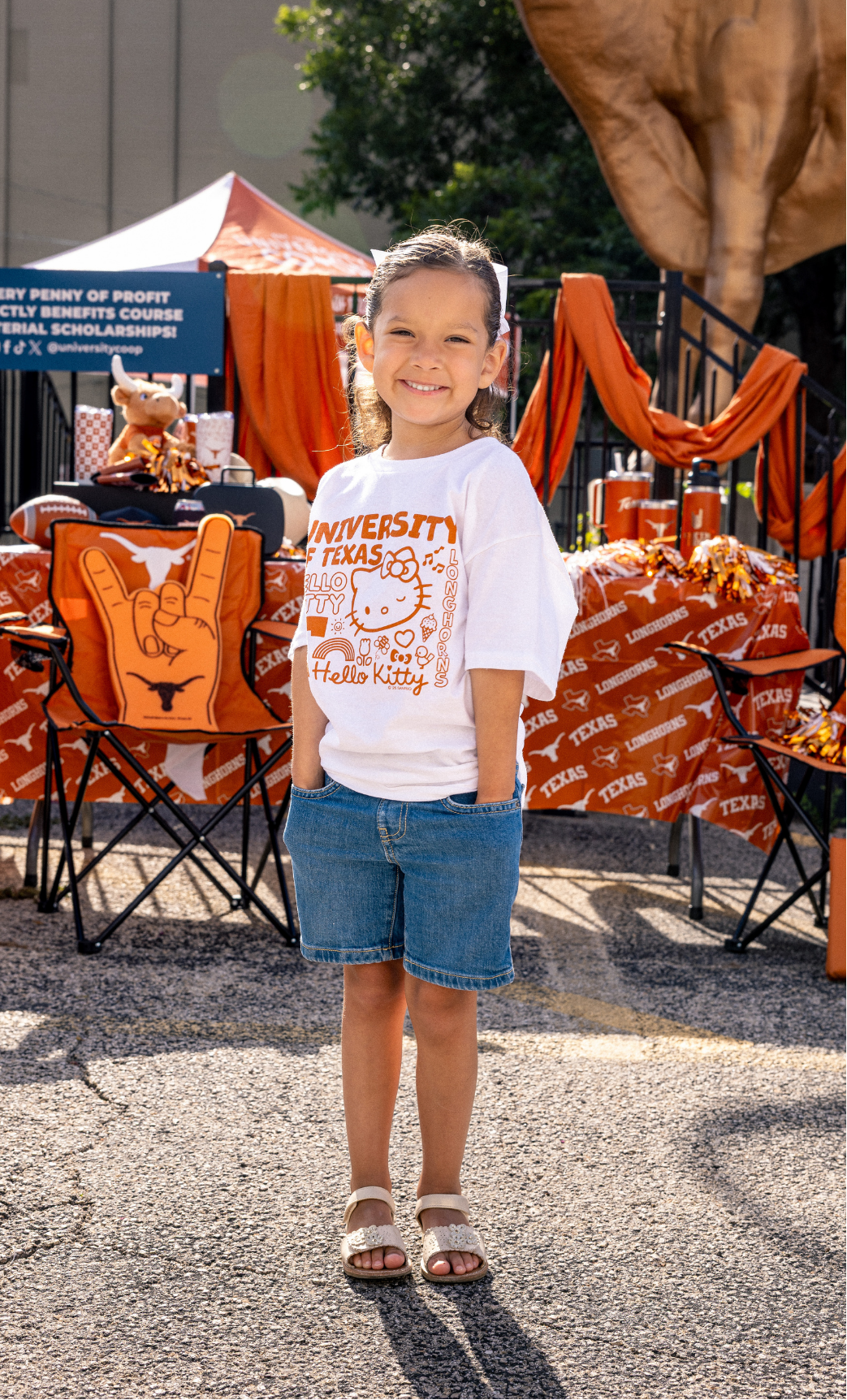 Young Longhorn fan wearing hello kitty longhorn t shirt